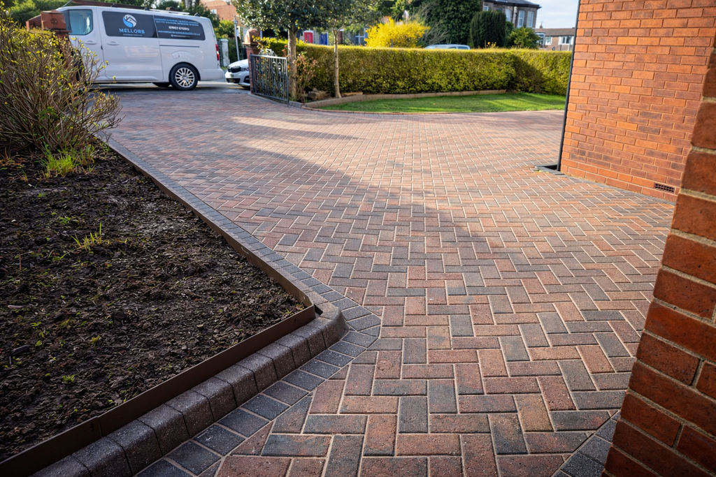 Freshly cleaned paving with a Mellors service van nearby
